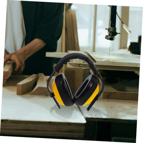 Lock Down Every Distraction Heavy Duty Noise Reduction Earmuffs on a workbench, designed for woodworking, featuring a black and yellow color scheme.