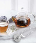 Glass teapot and cup with stainless steel tea infuser ball strainer with handle 3 pack ultra fine mesh filter for loose leaf tea on table
