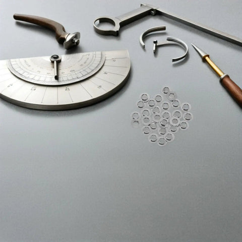 Stainless Steel Eyeglass Screw Washers 100Pcs For Rimless Glasses And Sunglasses Replacement Parts Wear And Corrosion Resistant Flat Gasket Spacers Universal Repair Kit Essentials For No Fuss Eyewear Fixes on workbench