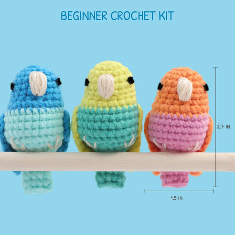 Beginner Crochet Kit For Amigurumi Birds Make 3 Mini Budgie Buds With Easy Peasy Step-By-Step Video Tutorial Yarn Hook Safety Eyes Stuffing Included Easy DIY Craft Kit Gift For Adults shown with 3 colorful crocheted budgie birds sitting on a perch, measuring 2.7 inches in height.