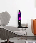 Purple Liquid Motion Lamp For Adults And Kids Magma Motion Lamp with White Wax on a side table near a chair in a living room.