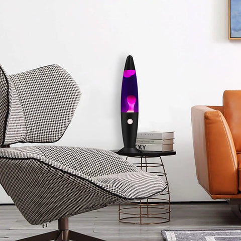 Purple Liquid Motion Lamp For Adults And Kids Magma Motion Lamp with White Wax on a side table near a chair in a living room.