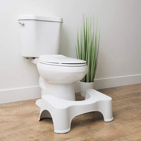7 Inch Toilet Stool For Killer Bathroom Posture And Comfort White, Ergonomic Stand For Standard Toilets 14 To 15.5 Inch And Comfort Height 16 To 18 Inch, Made In USA, As Seen On Shark Tank next to a white toilet