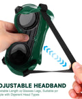 Hand adjusting the headband of Kickass Dual Flip Up Welding Goggles Built Tough As Nails With Impact Resistance Square Vents.