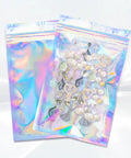Holographic Packaging Bags 3.1x4.7 Inch Resealable Foil Mylar Pouches displaying jewelry inside, shiny and durable