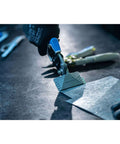 Pliers and seamers with forged head cutting 18 gauge metal, pro-grade tool with ergonomic rubber grip in use on metal surface
