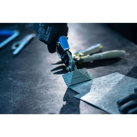 Pliers and seamers with forged head cutting 18 gauge metal, pro-grade tool with ergonomic rubber grip in use on metal surface