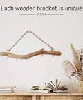 Badass 16 Inch Natural Wood Wall Hooks Featuring Five Curved Prongs For Hanging Heavy Jackets Tote Bags And Key Chains Inside Your Mudroom Or Entryway While Keeping Everything Slick And Organized, displayed on a wall with decorative items.