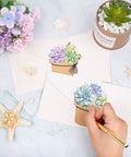 Hand writing on succulent-themed name tag stickers from the 120 Pieces Dope Succulent Name Tag Stickers Set With 12 Designs