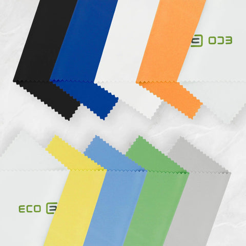 Camera lens microfiber cleaning cloths swatches in assorted colors arranged on a white background.