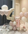 Giant Forty Inch Beige Mylar Foil Number 1 Balloon With Straw For First Birthday And Age Milestone Party Decorations displayed with pink balloons.