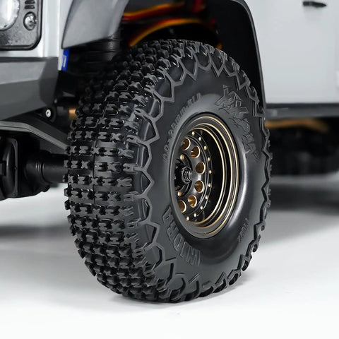 Close-up of S5 60x20mm XHX Pin Tire For SCX24 FCX24 1/18 1/24 RC Crawlers showing tread pattern and mounted on RC vehicle