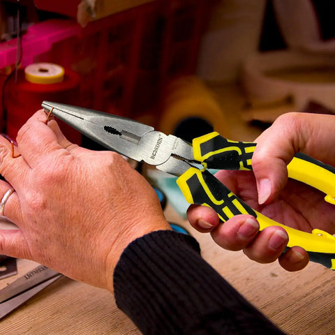 Using 8 Inch Needle Nose Pliers With Spring Loaded Action And Side Cutters for jewelry making, grasping small wire on workspace.