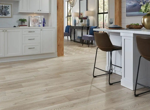 White Vinyl Wall Base Self-Stick Ultra Thick 1/8 Inch shown in modern kitchen interior with hardwood floors and white cabinets