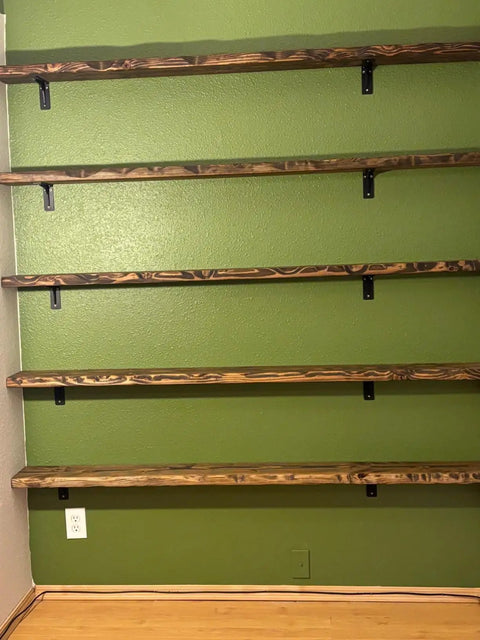 Heavy Duty 10x6 Inch Shelf Brackets Set Of 4 installed on green wall with wooden shelves