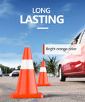 12 Pack 18 Inch Traffic Safety Cones With Reflective Collars, Durable PVC Construction, set on a road with cars passing by.