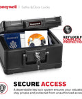 Open Compact Home Safe Box With Key Lock, Fireproof And Water Resistant, 0.15 cu ft, showing passport and DVD inside.