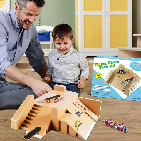 Smiling child with father playing on an All In One Finger Skate Park Kit With 3 Mini Finger Skateboards And 8 Ramp Decks DIY Skate Park