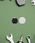 Durable Round Pin Buckle Sectional Furniture Connectors For Couch And Sofa on green surface with tools
