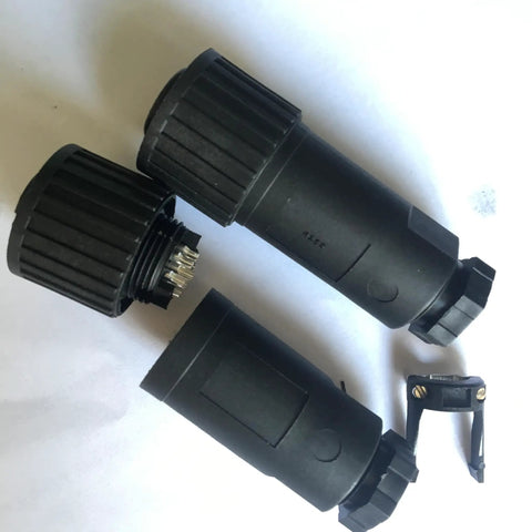 Heavy Duty Aviation Plug Connector With Seven Core Proportional Valve Hydraulic Coupler showing two black connectors and a clip.