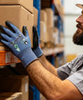 Worker using 60 Pairs ANSI A7 Cut Resistant Gloves For Men And Women, Touchscreen Ready, for handling cargo in a warehouse