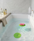 Flower Power Bathtub Drain Stopper With Chain Pink Green Universal 4 1 4 Inch Bath Plug in tub with soothing water and decor.