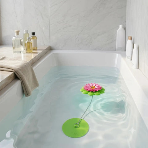 Flower Power Bathtub Drain Stopper With Chain Pink Green Universal 4 1 4 Inch Bath Plug in tub with soothing water and decor.