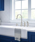 Top Shelf High Arc Kitchen Faucet With Spot Resist Stainless Finish And Smooth One Handle Design To Make Kitchen Chores An Absolute Breeze On Your Counter next to a farmhouse sink.