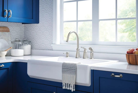 Top Shelf High Arc Kitchen Faucet With Spot Resist Stainless Finish And Smooth One Handle Design To Make Kitchen Chores An Absolute Breeze On Your Counter next to a farmhouse sink.