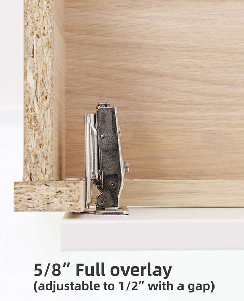 Side view of a metal 5/8-inch full-overlay concealed cabinet hinge mounted on a light wood kitchen cabinet door