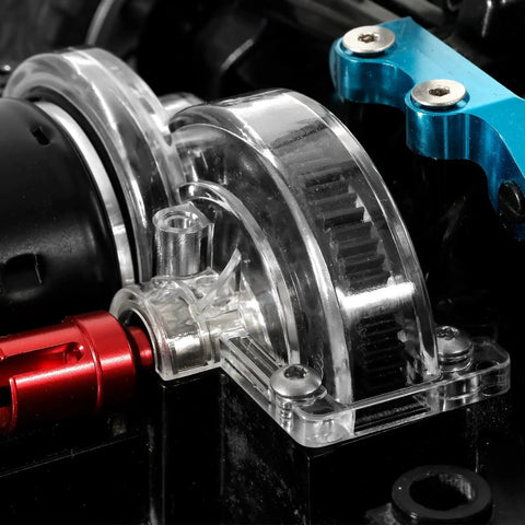 Transparent Spur Gear Covers For 1X10 RC Car TT02 on chassis, showcasing clear plastic gearbox case and main gear guard.