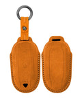Premium Suede Leather Key Fob Cover For Tesla Model X in orange, showcasing hand-stitched design and keyring for safety.