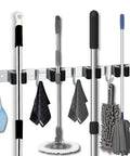 Heavy Duty Stainless Steel Wall Mount Broom Mop Holder And Tool Organizer With Four Racks And Five Hooks holding cleaning tools.