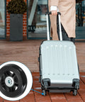 Person wheeling suitcase with 70x19mm Luggage Replacement Wheels Set Of 2 In PU Swivel Caster For Trolley Suitcase Repair Kit