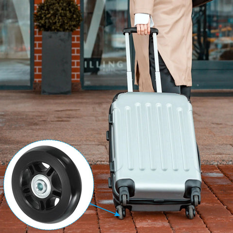 Person wheeling suitcase with 70x19mm Luggage Replacement Wheels Set Of 2 In PU Swivel Caster For Trolley Suitcase Repair Kit