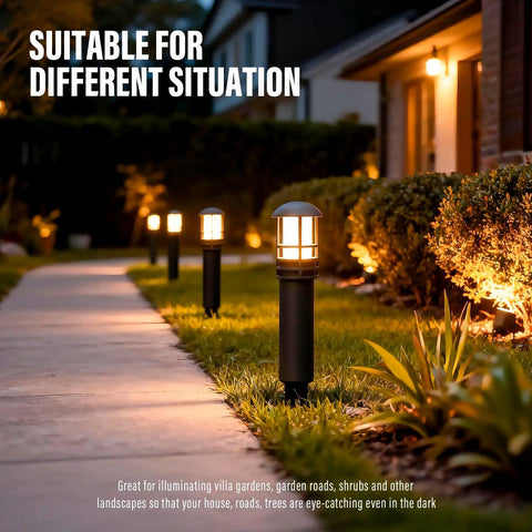 4 Pack Low Voltage Pathway Lights Dope 3W LED Outdoor Landscape Lighting 120 Lumen 3000K Warm White Wired Walkway And Driveway Lights In Black Metal With Connector illuminating a garden path at night.