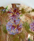 Close-up of 18 Inch Floral Epoxy Resin Lazy Susan With Turquoise Painted Wooden Base featuring intricate floral design.