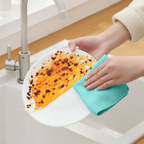 Person cleaning a stained plate with Ultra Soft Microfiber Cleaning Cloths 8 By 8 Inches 40 Pack Lint Free Rags Blue Color