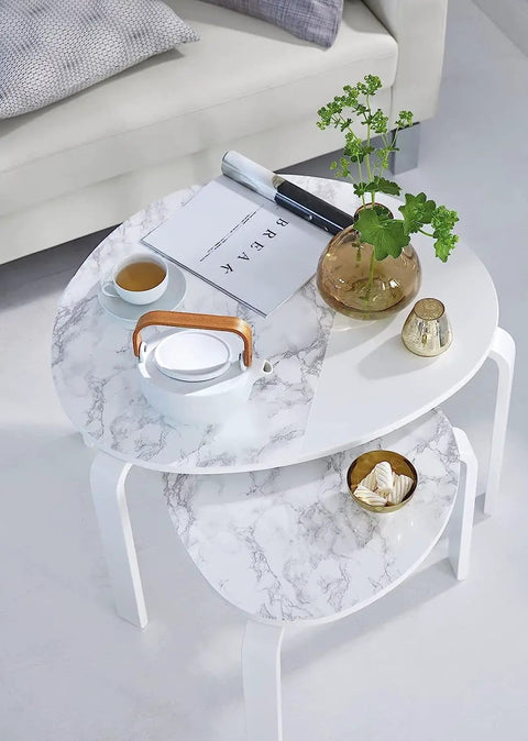 Round table covered with Grey Marble Peel And Stick Self-Adhesive Film Roll 17 Inch By 78 Inch for walls, cabinets, and shelves.