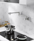 Built Tough Pot Filler Faucet For Modern Kitchens Featuring Brushed Nickel Finish wall mounted over stove filling pot.