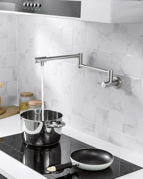 Built Tough Pot Filler Faucet For Modern Kitchens Featuring Brushed Nickel Finish wall mounted over stove filling pot.