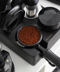 Kill Stubborn Espresso Ground Clumps Fast With This Dope 58mm Planetary Wdt Tool And Adjustable Needle Distributor For Barista Level Consistency Every Single Time with coffee grounds in a portafilter.