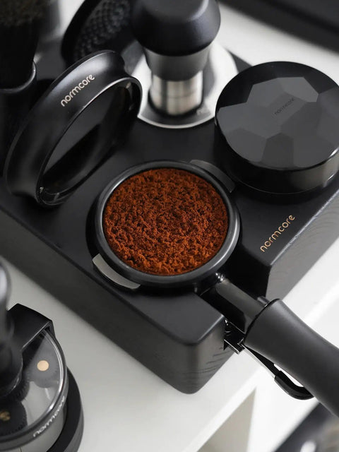 Kill Stubborn Espresso Ground Clumps Fast With This Dope 58mm Planetary Wdt Tool And Adjustable Needle Distributor For Barista Level Consistency Every Single Time with coffee grounds in a portafilter.
