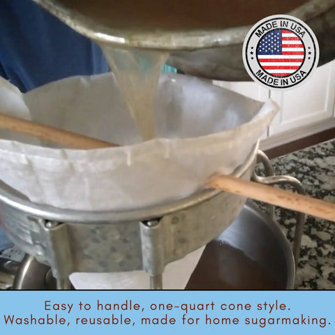 No Sweat Maple Syrup Tapping Kit For Trees With Ten Tough Three Foot Blue Drop Tubes Spiles One Quart Sap Filter pouring syrup.