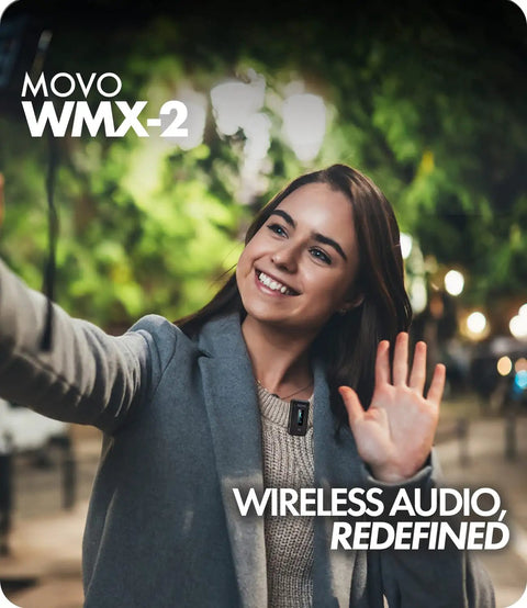 Smiling woman using WMX-2 Wireless Camera Microphone With Charging Case for DSLR, vlogging outdoors in park setting.