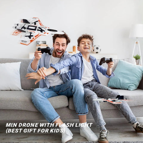 Father and son playing with No Assembly RC Fighter Plane For Kids With Auto Hover, 360 Degree Flips, Gravity Sensing Stunt Roll, 2.4GHz Remote, Foam Lightweight Design, Cool Lights, Includes 2 Batteries, Great Gift For 8 Plus Boys.