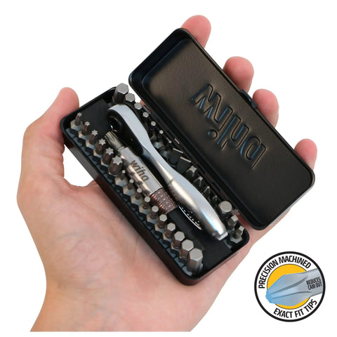 Hand holding a black 35 Piece Bit Ratchet Compact Storage Box Set With Slotted And Phillips Bits Square Torx And Hex 1/4 Inch Hex