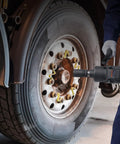 Hardcore 1 Inch Drive Air Impact Wrench Built Like A Tank To Pump Out 2730 Ft Lbs Breakaway Torque With Beast Mode Guts being used on a truck wheel.