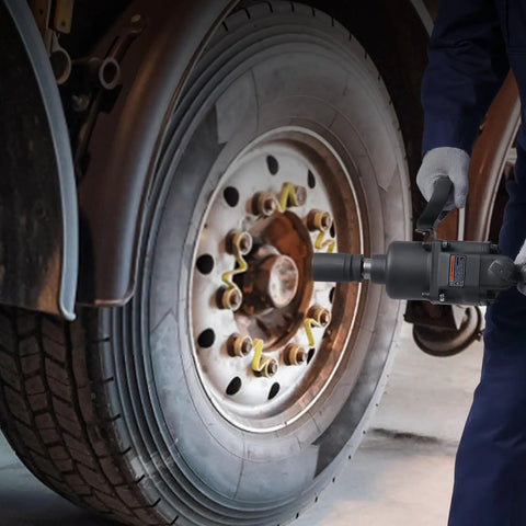 Hardcore 1 Inch Drive Air Impact Wrench Built Like A Tank To Pump Out 2730 Ft Lbs Breakaway Torque With Beast Mode Guts being used on a truck wheel.