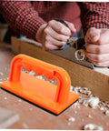 Heavy Duty Woodworking Safety Push Block For Table Saw And Router Tables Badass Shop Gear in bright orange with non-slip grip, used in woodworking.